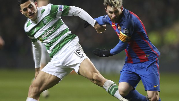 Rogic takes on Barcelona star Lionel Messi in the Champions League. 
