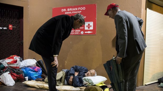 Treasurer Dominic Perrottet and Family and Community Services workers help homeless people in Woolloomooloo.