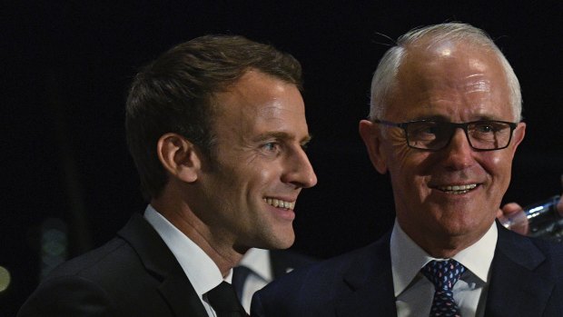 Missing out: President of France, Emmanuel Macron, left, and Prime Minister Malcolm Turnbull won't have Victorian officials on their guest list at a Sydney signing. 