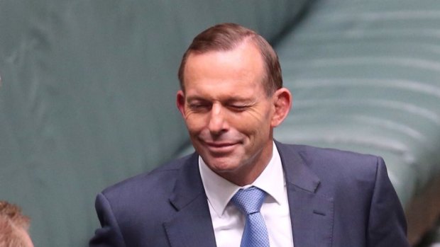 Prime Minister Tony Abbott winks at the conclusion of question time on Thursday.