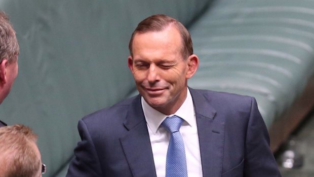 Prime Minister Tony Abbott winks at the conclusion of question time on Thursday.