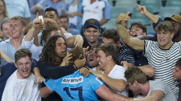 Support: Fans mob Harry Johnson-Holmes after the Waratahs snatched a late winner against the Stormers in February. 