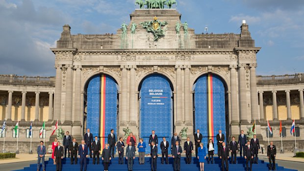 President Donald Trump on stage during a group photo of NATO heads of government at Park Cinquantenaire in Brussels, Belgium. 