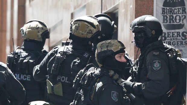 Special operations police assemble a block away from the siege in Sydney’s Martin Place.