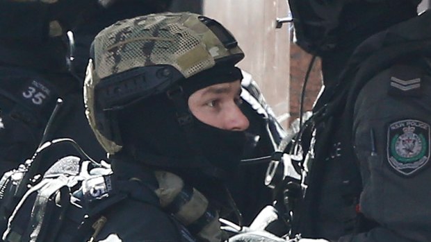 Special operations police assemble a block away from the siege in Sydney’s Martin Place.