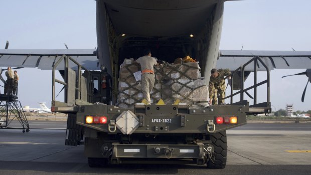 US air force personnel load pallets of medical and humanitarian aid supplies destined for Somalia at at Camp Lemonnier, Djibouti.