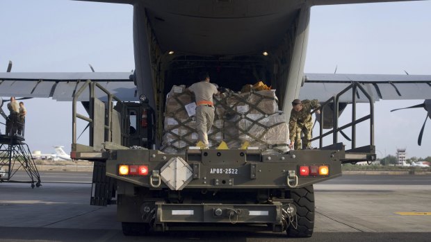 US air force personnel load pallets of medical and humanitarian aid supplies destined for Somalia at at Camp Lemonnier, Djibouti.