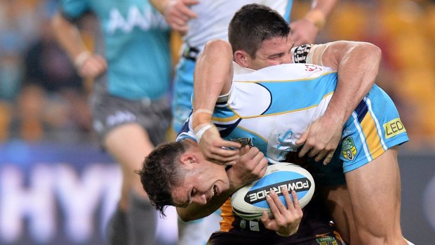 BRISBANE, AUSTRALIA - JULY 24:  James Roberts of the Titans is tackled during the round 20 NRL match between the Brisbane Broncos and the Gold Coast Titans at Suncorp Stadium on July 24, 2015 in Brisbane, Australia.  (Photo by Bradley Kanaris/Getty Images)