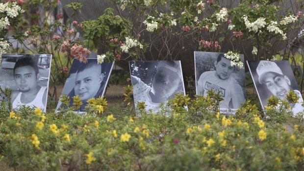 Photos of people killed in protests are displayed in a roundabout in Managua.