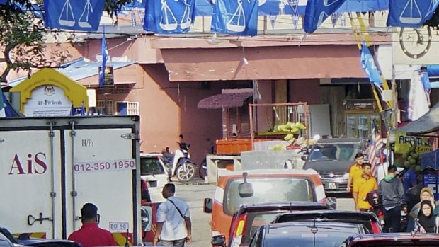 A street in Kampung Baru - Kuala Lumpur, Malaysia, covered by Barisan Nasional party flags and banners. Some banners were printed in China. 24 April 2018.