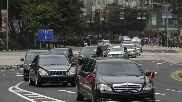 The North Korean motorcade, believed to be carrying North Korean leader Kim Jong-un, travels along Singapore's Orchard Road on Sunday, ahead of the summit with US leader Donald Trump..