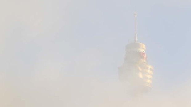 Fog blankets the city on Tuesday.