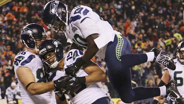 Seattle Seahawks wide receiver Jermaine Kearse celebrates his touchdown with Zach Miller and Derrick Coleman.