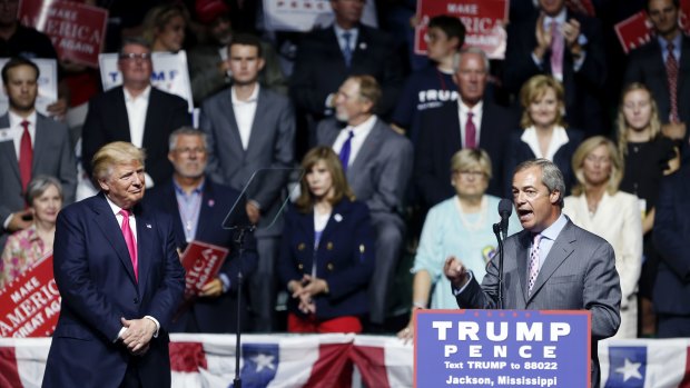 Nigel Farage, ex-leader of the British UKIP party, speaks as Republican presidential candidate Donald Trump, left, listens, at Trump's campaign rally in Jackson, Mississippi in 2016.