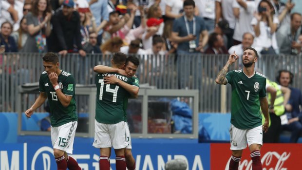 Mexico players celebrate the winning goal by Hirving Lozano.