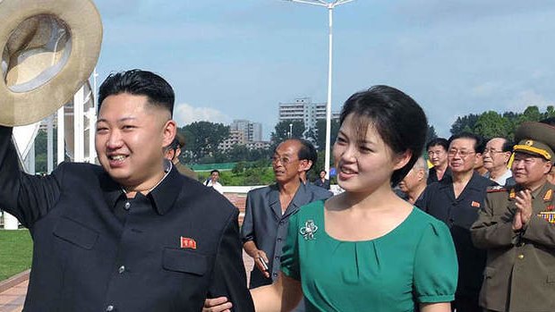 A picture released by North Korea's official Korean Central News Agency (KCNA) via the Korea News Service (KNS) on July 26, 2012  shows North Korean leader Kim Jong-Un (L), accompanied by his wife Ri Sol-Ju (R), visiting a wading pool at the Rungna People's Pleasure Ground in Pyongyang.