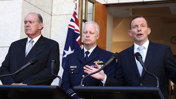 Defence Minister David Johnston, Hi ho. Chief of the Defence Force Air Chief Marshal Mark Binskin and Prime Minister Tony Abbott address the media during a joint press conference at Parliament House on Friday. Photo: Alex Ellinghausen