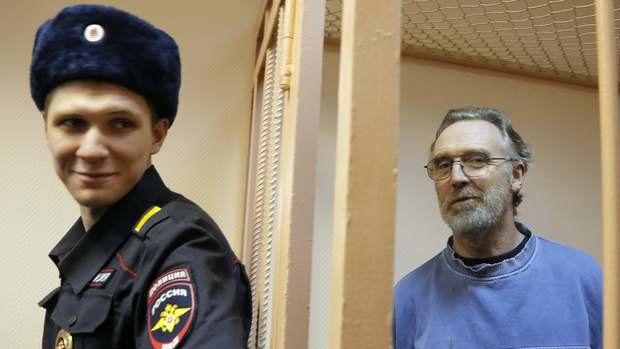 Unlikely to be home for Christmas ... Australian Greenpeace International activist Colin Russell stands in a cell during a court hearing in St. Petersburg, Russia. He is one of 30 activists arrested following a Greenpeace protest at an Arctic oil rig.