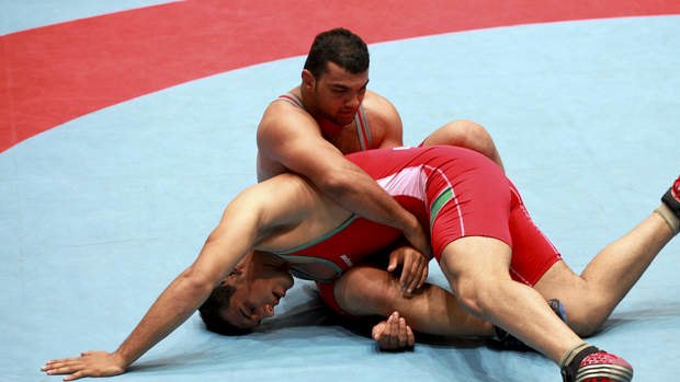 Iran's national free style wrestling team trains in Tehran on Sunday.