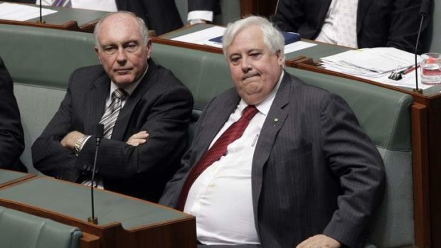 Clive Palmer sits with Deputy Prime Minister Warren Truss during a division related to the mining tax repeal bills. Photo: Andrew Meares