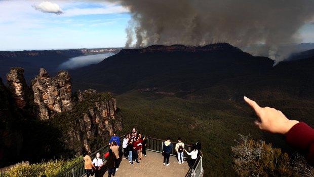 Tourists at Echo Point, Katoomba, get more than they bargained for during visits to the Blue Mountains.