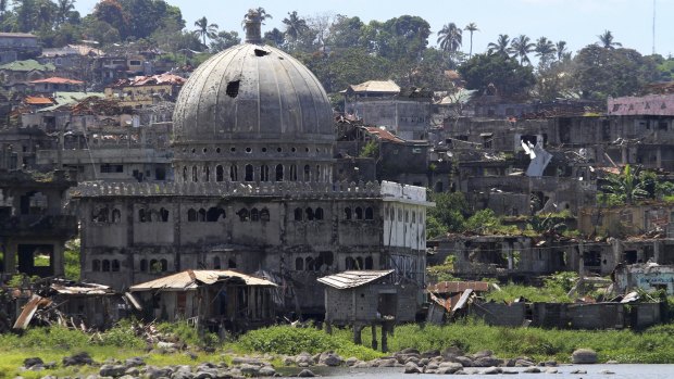 Weeds grow on the ruins of Marawi city in southern Philippines exactly a year after Filipino Muslim militants laid siege, last week.