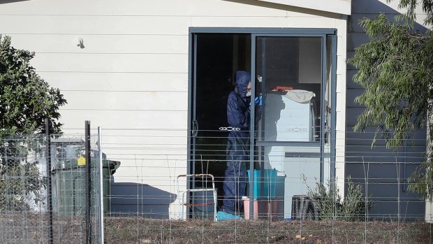 Police forensics investigate the death of seven people in a suspected murder-suicide in Osmington on Friday.