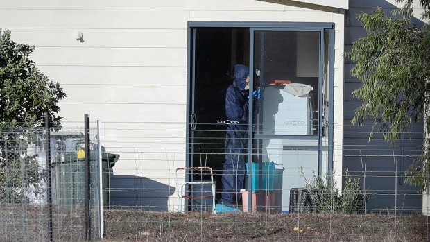 Police forensics investigate the death of seven people in a suspected murder-suicide in Osmington on Friday.