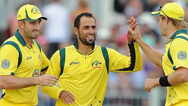Australia's Fawad Ahmed (C) celebrates taking a T20 wicket for Australia with Shaun Marsh and Shane Watson, August 31, 2013.