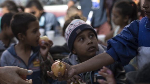 Children wait for breakfast at a migrant shelter in Tijuana, Mexico, on April 28. 