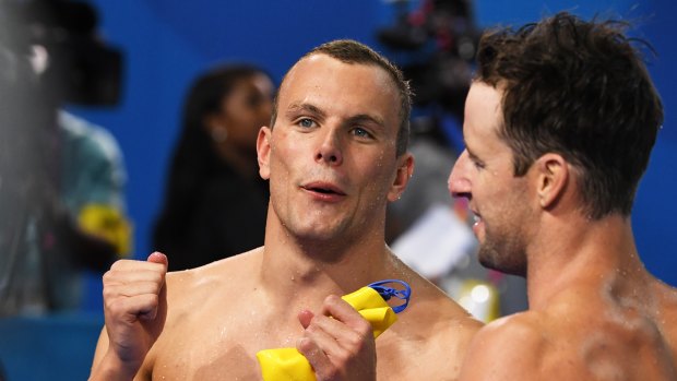 Golden moment: Kyle Chalmers (left) and James Magnussen celebrate victory in the 4x100m relay.