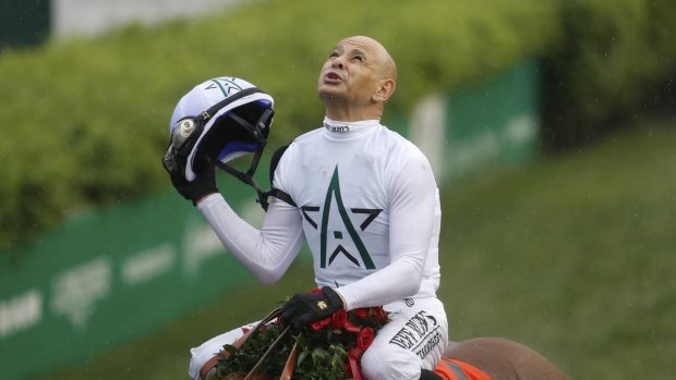 Big win: Mike Smith celebrates after riding Justify to the Kentucky Derby.