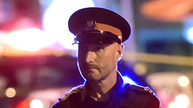 Police work the scene of a shooting in Toronto.