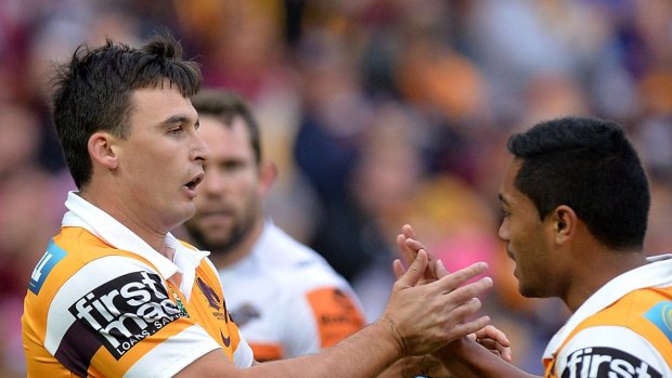 BRISBANE, AUSTRALIA - JULY 19:  Lachlan Maranta of the Broncos celebrates with team mate Anthony Milford after scoring a try during the round 19 NRL match between the Brisbane Broncos and the Wests Tigers at Suncorp Stadium on July 19, 2015 in Brisbane, Australia.  (Photo by Bradley Kanaris/Getty Images)