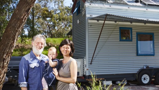 Fred Schultz, wife Shannon and daughter Olina with the tiny home Mr Schultz built.