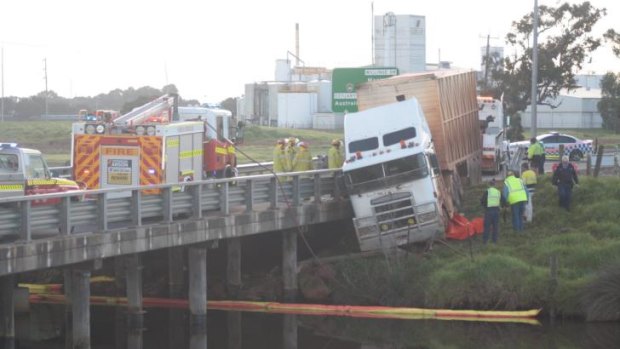 The truck was left dangling precariously over a bridge in Bunbury on Wednesday morning.