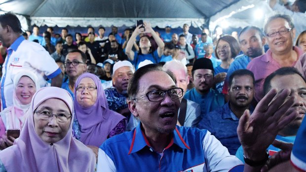 Deputy Prime Minister Wan Azizah (left) with her husband Anwar Ibrahim at a rally in his first speech after being released from prison in Kuala Lumpur.