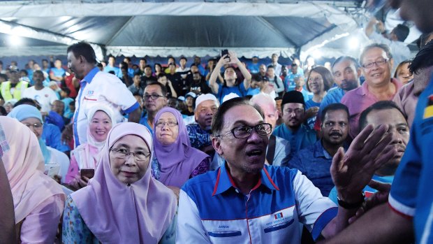 Deputy Prime Minister Wan Azizah (left) with her husband Anwar Ibrahim at a rally in his first speech after being released from prison in Kuala Lumpur.