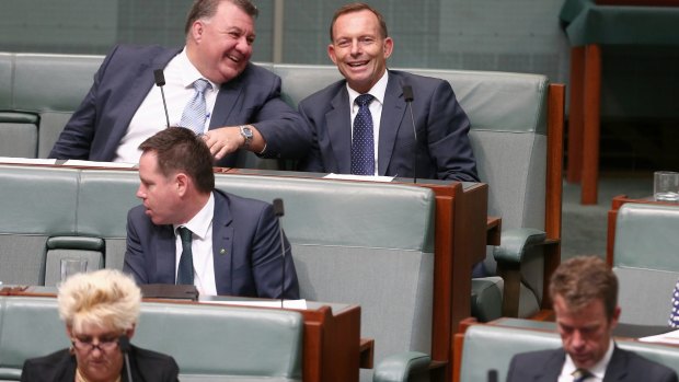 Liberal MP Craig Kelly in discussion with former prime minister Tony Abbott  during question time on Monday.