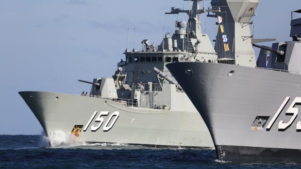 Anzac-class frigate HMAS Anzac (150) passes HMAS Ballarat (153) during a transit through in Western Australia.