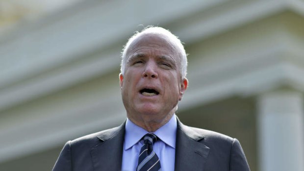 US Senator John McCain answers questions following a meeting with US President Barack Obama.