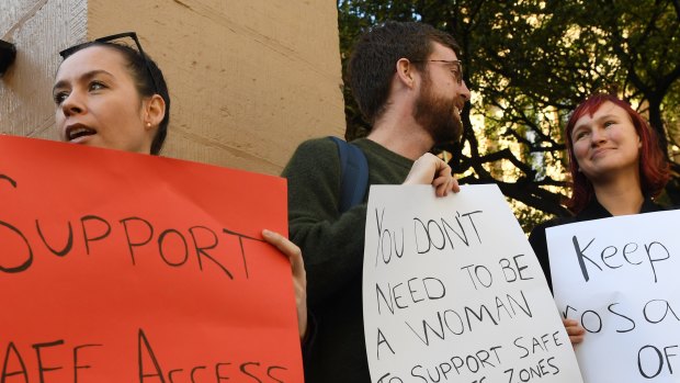 Demonstrators in favour of safe access zones around NSW abortion clinics stand outside NSW State Parliament last month. 