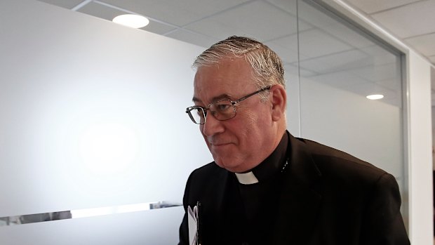 Catholic Priest Juan Ignacio Gonzalez, spokesperson for Chile's Episcopal Conference, leaves after giving a press conference about a letter from Pope Francis in Santiago, Chile,.