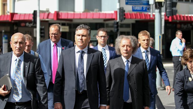 Dreamworld CEO Craig Davidson (centre) arrives with lawyers to the pre-inquest hearing in April into the fatal accident at the Dreamworld theme park.