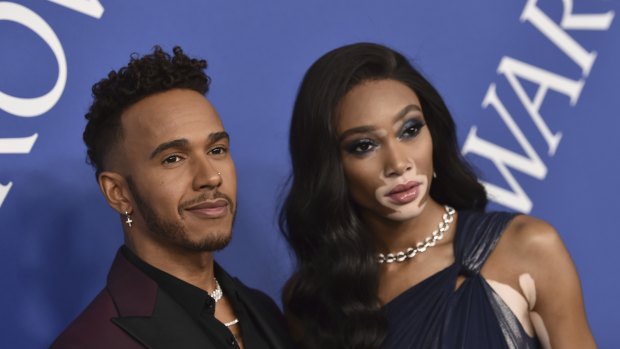 Winnie Harlow, right, pictured with Lewis Hamilton earlier this month.