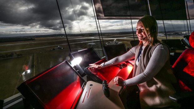 Kristen Roe , enroute air traffic controller, behind the console at Tullamarine tower.
