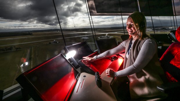 Kristen Roe , enroute air traffic controller, behind the console at Tullamarine tower.