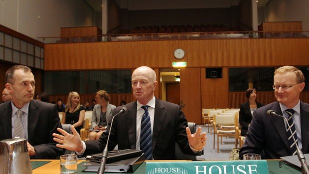 Glenn Stevens, centre, pictured with Christopher Kent and Philip Lowe, gives a tough assessment of the government's economic management.
