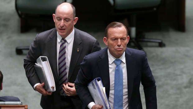 Assistant Defence Minister Stuart Robert and Prime Minister Tony Abbott depart question time on Thursday.