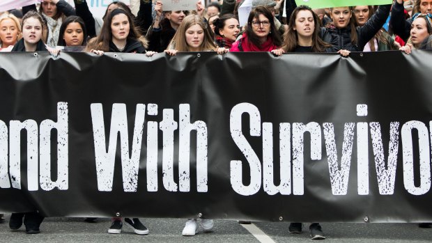 People take part in a protest in Dublin, in support of the woman at the centre of a rape trial after two Ireland ruby players were acquitted. 